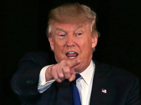 In this Dec. 10, 2015, photo, Republican presidential candidate, businessman Donald Trump gestures during an address at a regional police union meeting in Portsmouth, N.H.(AP PHOTO)