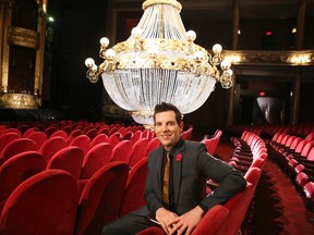 Actor Chris Mann, who plays the title role in The Phantom of the Opera poses in front of the famous Chandelier during a backstage tour of the upcoming show at the Princess of Wales Theatre on Dec. 9, 2015. (Veronica Henri/Toronto Sun)