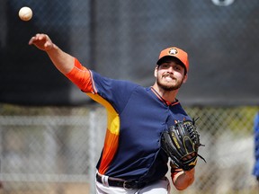 In this Feb. 21, 2015, file photo, Houston Astros pitcher Mark Appel throws the ball during a spring training baseball workout in Kissimmee, Fla. (AP Photo/David Goldman, File)