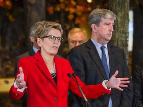 Ontario Premier Kathleen Wynne and Environment Minister Glen Murray talk to media about the new provincial climate change strategy at the Royal Ontario Museum on Nov. 24, 2015. (Ernest Doroszuk/Toronto Sun)