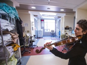 Violinist Elena Spanu plays to intensive care patients at Toronto Western Hospital's Loretta Anne Rogers Critical Care Centre.