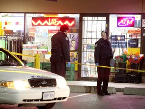 Toronto Police investigate a murder at a strip mall on Parkway Forest Dr., near Don Mills Rd. and Sheppard Ave. on Dec. 12, 2015. (John Hanley/Special to the Toronto Sun)