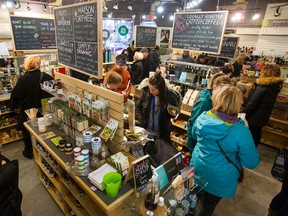 Shoppers fill Carbon Environmental Boutique during a cash mob on High Street on 124 Street in Edmonton, Alta., on Saturday December 12, 2015. Business owners in the area say they've been negatively affected by delays in the construction of the 102 Avenue bridge. Ian Kucerak/Edmonton Sun/Postmedia Network