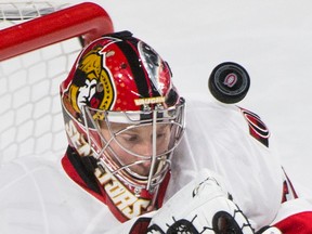 Ottawa Senators' goaltender Craig Anderson makes a save against the Montreal Canadiens during first period NHL hockey action, in Montreal, on Saturday, Dec. 12, 2015. 
THE CANADIAN PRESS/Graham Hughes