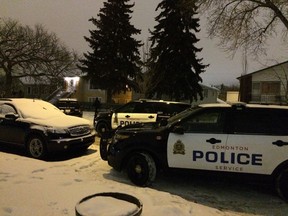 Police cars on the scene of a possible shooting at 107 Avenue and 106 Street Saturday night. (CATHERINE GRIWKOWSKY/Edmonton Sun)