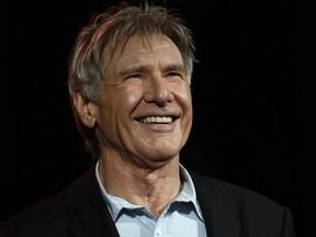 Harrison Ford smiles as he greets fans at a Star Wars fan event in Sydney Thursday, Dec. 10, 2015. Ford is in Australia to promote his latest film "Star Wars: The Force Awakens." (AP Photo/Rob Griffith)