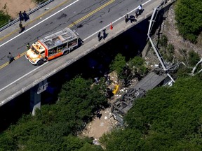 Aerial view of the overturned bus which crashed in Argentina's northern province of Salta, on Dec. 14, 2015. A bus carrying Argentine border patrol officers crashed into a ravine in Salta on Monday, killing 42 people, while nine were being treated for injuries, provincial emergency official Francisco Marinaro told local television.  (REUTERS/Javier Corbalan)