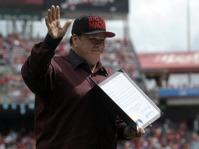 Pete Rose acknowledges the crowd during a ceremony in honor of the 30th anniversary of breaking the all-time hits record at Great American Ball Park on September 12, 2015 in Cincinnati, Ohio.   Dylan Buell/Getty Images/AFP