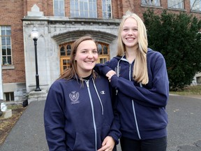 Kingston Collegiate and Vocational grade 12 students Lily Wheeler-Dee, left, and Rachel Porter in front of the school on Thursday December 10 2015. Ian MacAlpine /The Kingston Whig-Standard/Postmedia Network