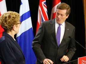 Mayor John Tory and Premier Kathleen Wynne hold a media availability after their morning meeting at Queen's Park in Toronto Monday December 14, 2015. (Michael Peake/Toronto Sun)