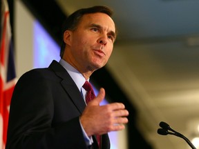 Canada’s Minister of Finance, Bill Morneau speaks at the Toronto Region Board of Trade meeting at the Hilton Hotel in Toronto, Ont. on Monday, December 14, 2015. Morneau is warning the public against uncertain economic times. Dave Abel/Toronto Sun/Postmedia Network