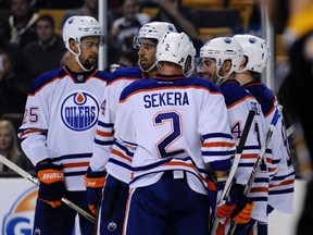 Edmonton Oilers celebrate a first-period goal against the Bruins on Monday. (USA TODAY SPORTS)