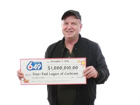 Jean-Paul Lagace holds a big cheque for a large amount of money after he collected his winnings earlier this month. Photo submitted