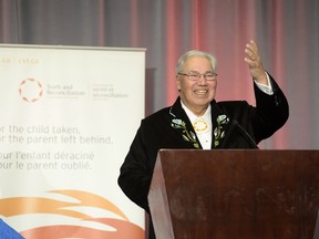 Justice Murray Sinclair greets the audience at the release of the Final Report of the Truth and Reconciliation Commission of Canada on the history of Canada's residential school system, in Ottawa on Tuesday, Dec. 15, 2015. THE CANADIAN PRESS/Adrian Wyld