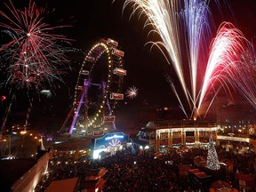 Fireworks explode beside Vienna's Giant Ferris Wheel (Wiener Riesenrad) at Prater park during New Year celebrations in Vienna in this Jan. 1, 2012 file photo. REUTERS/Lisi Niesner