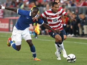 Edgar Castillo #15 of USA tries to get away from Tosaint Ricketts #15 of Canada during their international friendly match on June 3, 2012 at BMO Field in Toronto, Ontario, Canada.   Tom Szczerbowski/Getty Images/AFP