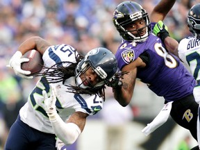 Seattle Seahawks cornerback Richard Sherman (25) gets his hair pulled while being tackled by Baltimore Ravens wide receiver Chris Matthews (84) at M&T Bank Stadium. Evan Habeeb-USA TODAY Sports