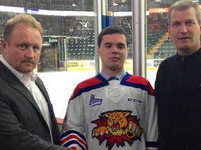 Sudbury's Ryan Mooney (centre) poses with Moncton Wildcats director of hockey operations Roger Shannon (left) and head coach Darren Rumble.