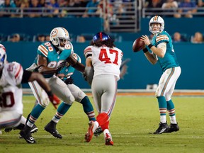 Miami Dolphins quarterback Ryan Tannehill throws a touchdown pass during the second half against the New York Giants at Sun Life Stadium on Dec. 14, 2015. (Steve Mitchell/USA TODAY Sports)