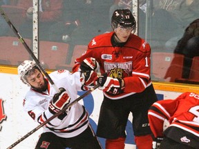 Sudbury Wolves newcomer Jarett Meyer, pictured here playing for the Owen Sound Attack battling with Niagara IceDogs' Mitchell Fitzmorris on Jan. 28, 2015, is happy to be in the Nickel City.