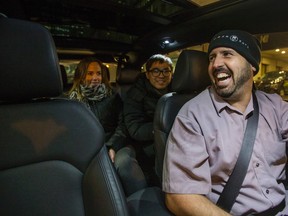 Uber driver Taylor Bailey has his Kia Rondo vehicle loaded with passengers going to the Distillery District with the UberHop service on Tuesday December 15, 2015.  (Ernest Doroszuk/Toronto Sun)