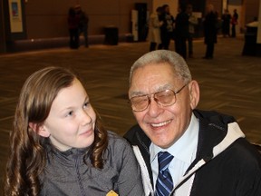 John Banksland, a residential school survivor, with his granddaughter, Kelly-Anne Leith. (after the TRC final report/presser) (Julienne Bay/Ottawa Sun)