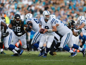 Colts quarterback Matt Hasselbeck (8) turns to hand off the ball against the Jaguars during third quarter NFL action in Jacksonville, Fla., on Sunday, Dec. 13, 2015. (Jim Steve/USA TODAY Sports)
