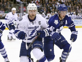 Tampa Bay Lightning centre Steven Stamkos competes for the puck against Toronto Maple Leafs centre Tyler Bozak at Air Canada Centre in Toronto on Dec. 15, 2015. (Tom Szczerbowski/USA TODAY Sports)