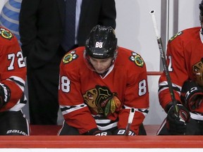 Chicago Blackhawks right winger Patrick Kane looks down on the bench during the closing minutes of the third period against the Colorado Avalanche in Chicago on Dec. 15, 2015. (AP Photo/Charles Rex Arbogast)