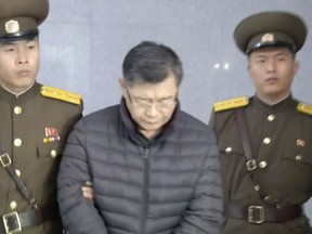In this image made from video, Hyeon Soo Lim, who pastors the Light Korean Presbyterian Church in Toronto, is escorted to his sentencing in Pyongyang, North Korea, Wednesday, Dec. 16, 2015. North Korea's Supreme Court sentenced a Canadian pastor to life in prison with hard labor on Wednesday for what it called crimes against the state. (AP Photo/APTN)
