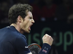 Britain’s Andy Murray celebrates during his match with Belgium’s David Goffin in the Davis Cup final at Flanders Expo in Ghent on November 29, 2015. (AFP PHOTO/JOHN THYS)