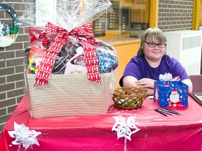 Lucknow Central student Nick Anson, 13, is seen working the 'Bear with Us' fundraising table to work towards adopting an orphaned bear cub. (DARRYL COOTE/LUCKNOW SENTINEL)