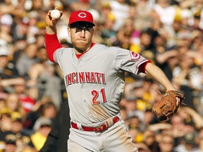 Todd Frazier of the Cincinnati Reds makes a throw to first base against the Pittsburgh Pirates at PNC Park on October 4, 2015 in Pittsburgh. (Justin K. Aller/Getty Images/AFP)
