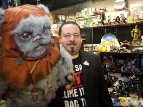 Michael Paille, owner of Cobra Collectibles, displays some of his Star Wars merchandise in his store in Winnipeg, Man. Tuesday December 15, 2015. Paille expects heavy sales to coincide with the opening of the new Star Wars movie.