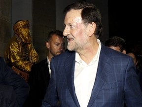 A deep red mark is seen on Spanish Prime Minister Mariano Rajoy's face after he was punched by a man during a campaign event for Sunday's general election in Pontevedra, Spain, December 16, 2015. (REUTERS/Monica Patxot-Pontevedraviva.com)
