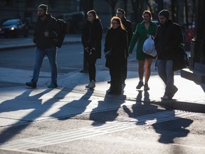 Pedestrians at Yonge St. and Front St. in downtown Toronto. (Ernest Doroszuk/Toronto Sun/Postmedia Network)