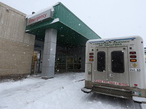 A stretcher service vehicle sits at the emergency department entrance after off-loading a patient at Concordia Hospital in Winnipeg on Wed., Dec. 16, 2015. A report says the city has the longest ER wait times in the country. Kevin King/Winnipeg Sun/Postmedia Network