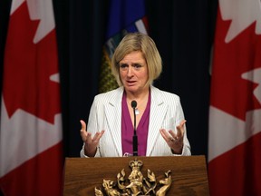 Premier Rachel Notley speaks to the media on the wrap up of the year events at the Alberta Legislature in Edmonton, Alberta on December 10, 2015. The Alberta government recently implemented a series of policy changes that will leave Albertans materially less free. Perry Mah /Edmonton Sun/Postmedia Network