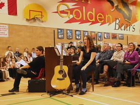 Heather Dawe directs the students in the concert with hand movements December 15.(Shaun Gregory/Huron Expositor)