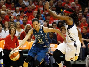 Minnesota Lynx guard Anna Cruz (left) drives against Indiana Fever guard Shavonte Zellous (right) during Game 3 of the WNBA Finals in Indianapolis on Oct. 9, 2015. (AJ Mast/AP Photo)