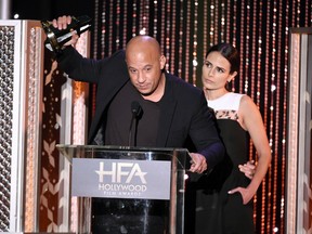 Vin Diesel, left, and Jordana Brewster accept the Hollywood blockbuster award for "Furious 7," at the Hollywood Film Awards at the Beverly Hilton Hotel on Sunday, Nov. 1, 2015, in Beverly Hills, Calif. (Chris Pizzello/Invision/AP)