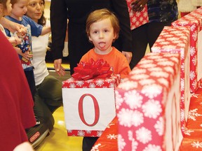 Sebastian Lepine, 4, helps reveal Health Sciences North's Volunteer Association's donation to the NEO Kids Foundation at the Children's Treatment Centre in Sudbury, Ont. on Wednesday December 16, 2015. The association donated $500,000. John Lappa/Sudbury Star/Postmedia Network