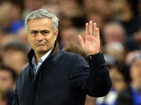 In this Wednesday, Nov. 4, 2015 file photo, Chelsea manager Jose Mourinho waves to fans singing in his support during the Champions League Group G soccer match between Chelsea and Dynamo Kiev at Stamford Bridge Stadium in London.  Mourinho has left Chelsea with the club languishing one point above the relegation zone just seven months after winning the Premier League title, it was reported on Thursday, Dec. 17, 2015. (AP Photo/Matt Dunham, File)