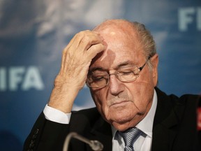 In this Dec. 19, 2014 file photo FIFA president Sepp Blatter gestures as he attends a press conference in Marrakech, Morocco. (AP Photo/Christophe Ena, file)