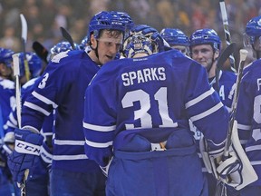 Toronto Maple Leafs defenceman Dion Phaneuf (3) congratulates goaltender Garret Sparks (31) after a win over the New Jersey Devils at the Air Canada Centre. Toronto defeated New Jersey 3-2 in an overtime shootout. Mandatory Credit: John E. Sokolowski-USA TODAY Sports
