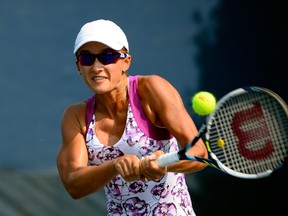 Arina Rodionova returns a shot to during doubles play in the U.S. Open at the USTA Billie Jean King National Tennis Center on September 2, 2015. (Alex Goodlett/Getty Images/AFP)