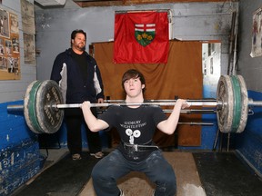 Alex Fera, head coach of the Sudbury Weightlifting Club, works with weightlifter Joel Asselin in Sudbury, Ont. on Wednesday December 16, 2015.