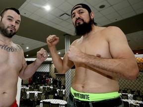 Tim Hague, left, and Tony Lopez pose following the weigh-in for Friday's Unified MMA25 at the Capilano Community Centre. (Tom Braid, Edmonton Sun)