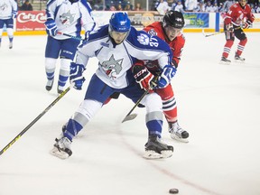 Nick Pastorius of the Niagara IceDogs tangles with Zach Wilkie of the Sudbury Wolves in OHL action at the Meridian Centre in St. Catharines on Thursday, December 17, 2015.