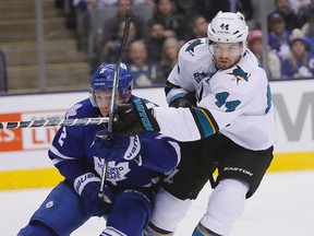 San Jose Sharks defenceman Marc-Edouard Vlasic and Toronto Maple Leafs defenceman Matt Hunwick battle for position during the first period at the Air Canada Centre on Dec. 17, 2015. (John E. Sokolowski/USA TODAY Sports)